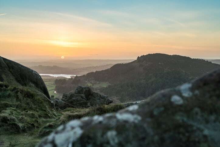 Wirksworth - View over soft-focus rock in foreground at the Black Rocks, Peak District, Derbyshire.